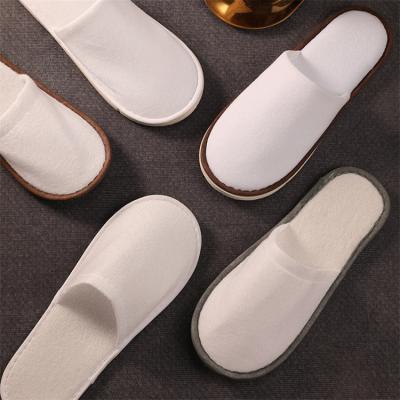 China Lightweight High Quality Closed Non-slip Hotel Slippers White Toe Disposable Hotel Bathroom Slippers for sale