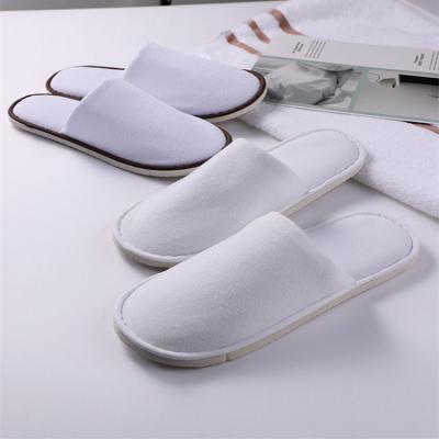 China Disposable Hotel Slippers Coral Fleece Hotel White Slippers Lightweight Custom Logo Housekeeping Five Star Slippers for sale