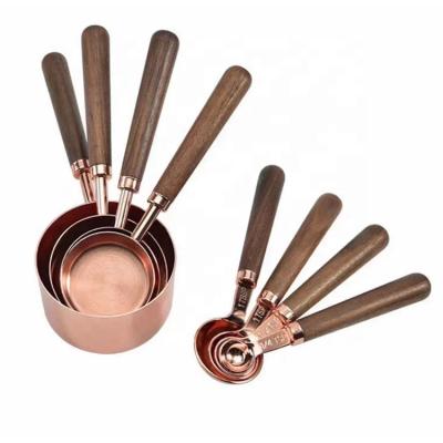 China Viable High Quality Wooden Handle 8pcs Rose Gold Coating Stainless Steel Measuring Cup and Spoon Cooking Set for sale