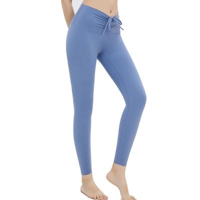 China Breathable Tight Woman Jogging Pants Yoga Pants Women Wearing Tight Yoga Pants Shiny Yoga Drop Shipping for sale