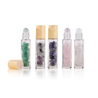 China Wholesale Cosmetic Packaging 10ml Gemstones Essential Oil Roller Clear Glass Bottle With Bamboo Lid for sale