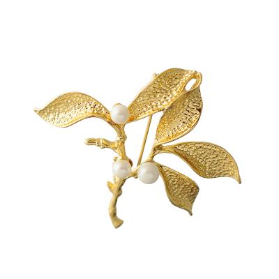 China ALLOY Nursing Kid Graduation Design Tree Branch Initial Elegant Creative Gold Plated Leaf Pearl Brooch New for sale