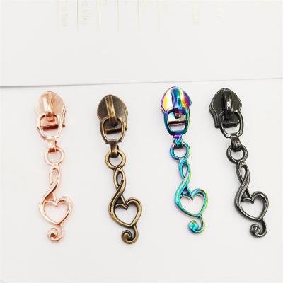 China Nickel free design custom logo zipper pull, metal zipper puller for bags clothes for sale