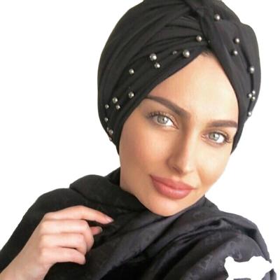 China Fashionable 2021 Wholesale suede turbans fashionable and Beautiful caps with pearl decoration Muslim ladies Hijabs for sale