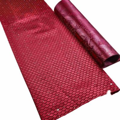 China Professional Manufacturer Good Price Mesh Lace Fabric Unique 100% Polyester Water Soluble Embroidered Rhinestone Net Mesh Fabric for sale