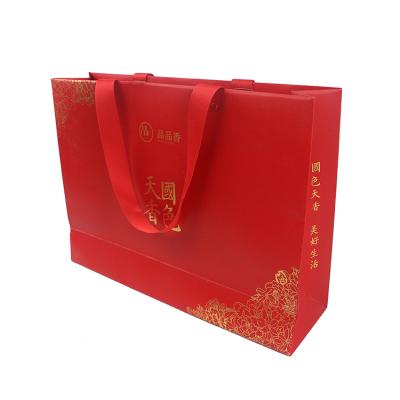 China Best Selling Recycled Materials Liquor Gift Packaging Bags Paper Bags With Logo Print for sale