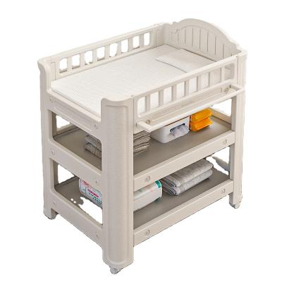 China Modern Multifunctional Baby Crib Hutch Bath Care Table with Wheels Changing Diaper Table for sale