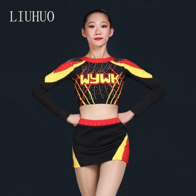 China Dress Up Custom Logo New Style Belly Exposed Costumes Gold Black Spandex Cheerleading Uniforms for sale