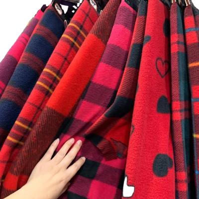 China Waterproof Soft 100% Polyester Azo Free Knitted Custom Plaid Printed Fleece Fabric for sale