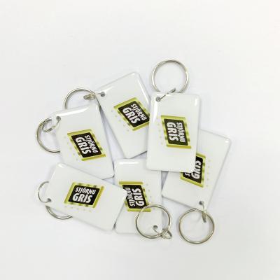 China 13.56mhz rfid rfid epoxy chip card crystal card rfid keyfob waterproof/waterproof custom plastic key tag with elastic key chains for sale