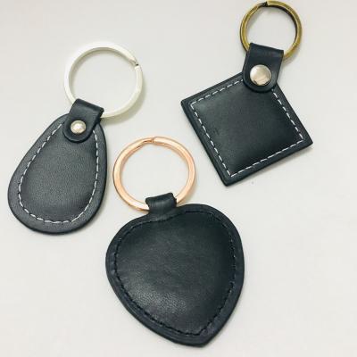 China Manufacturer 3D/2D Custom Trademark Logo Real Leather Key Chain Keychains Custom Factory Waterproof/Waterproof for sale