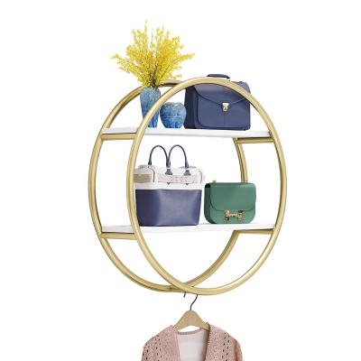 China Morden Decoration Luxury Metal Round Shape Shiny Gold Wall Bag Clothing Display Stand For Clothing Store for sale