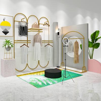 China Morden Wholesale Clothing Display Racks Round Wall Hanging Clothes Boutique Store Display Rack Stand Clothing Rack Display for sale