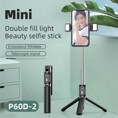 China Fold Up Mini Double Sufficiency Light Beauty Supplement Telescopic Collapsible Selfie Stick Tripod Holder with Detachable Wireless Remote Control for sale