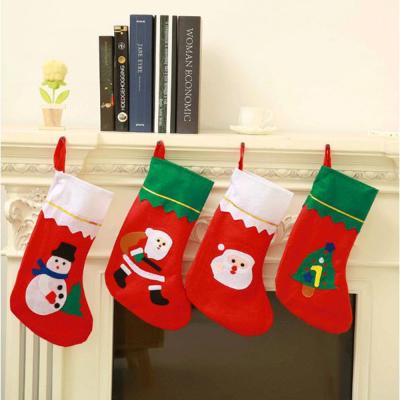 China Christmas Decoration Supplies Lovely Santa Elk Fabric Gift Socks Large Christmas Stocking Bag For Kids Chimney Tree Christmas Decoration for sale