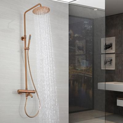 China With Sliding Bar Rose Golden Faucet Wall Mounted Rainfall Shower Faucet Luxury Rain Shower Set for sale