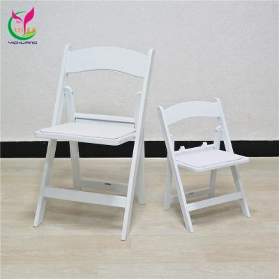 China Modern Outdoor Wooden Portable Weeding Party Kids White Resin Folding Chair for sale