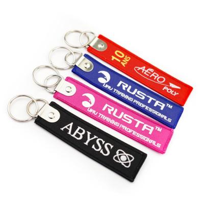 China All Embroidery Key Chain Woven Patch Flight Tag Woven Embroidery Key Chain Custom Logo for sale