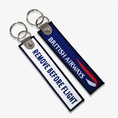 China All Cheap Custom Made Cloth Double Sided Flight Indicators Theft Motion Indicators Car Logo Embroidery Keychain for sale