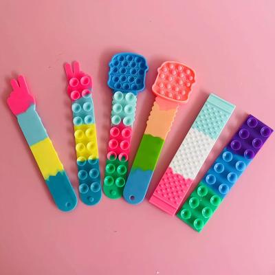 China 2022 Silicone Squidopops Wristband Noise Itting Kids Stir Toy, Suction Cup Squidopops Ring Push Antistress Noise Itting Toys for sale