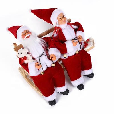 China 30cm Mr&Mrs Santa Sitting On Bench Ornament Luxury Figurine Collectible Vacation for sale