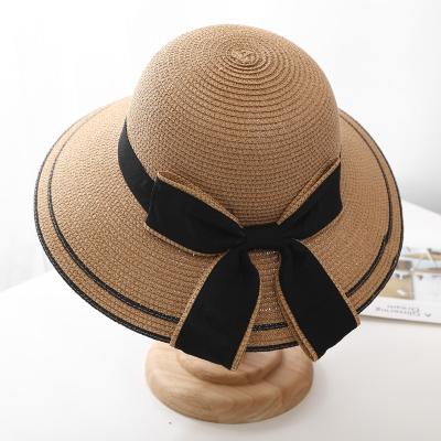 China Summer Soft/Comfortable Women Fashion Wholeseal Sun Paper Bucket Straw Hat With Bow Ribbon for sale