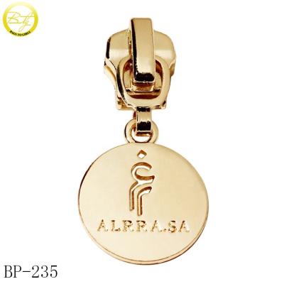 China Nickel Free Fancy Bags Accessory Metal Circle Puller Tags Customized Hollow Letter Gold Metal Puller Logos For Coat for sale