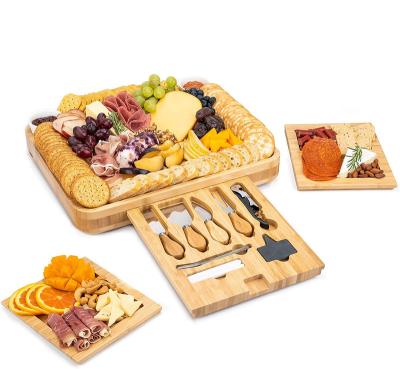 China Sustainable Bamboo Wooden Deli Slide-Out 4 Drawer Magnetic Cheese Board Set With Ceramic Bowls And Bamboo Cutlery Knife Cheese Board for sale