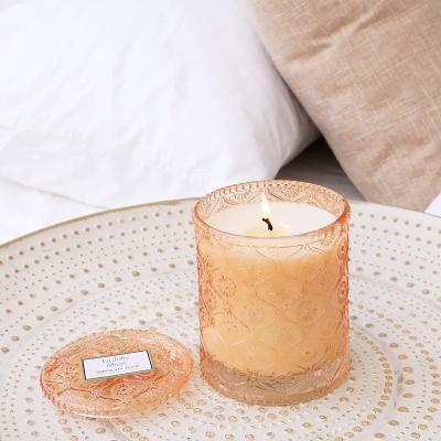 China Non Spill Beige Embossed Glass Candle Container With Lid Home Glass Candle Jar for sale