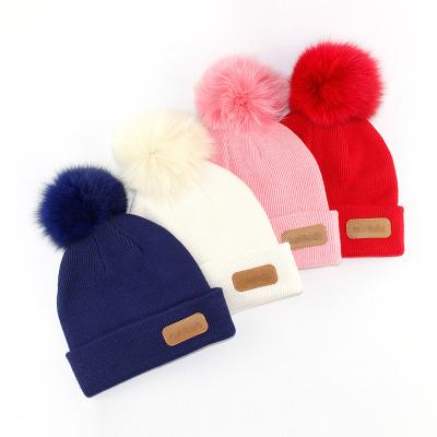 China New COMMON Style Adult Baby Kids Winter Warm Pom Poms Hat Custom Knitted Pom Beanie Hat With Fur Top Ball for sale