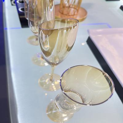 China Beautiful Durable Wholesale Custom Gold Hand Plastic Tumbler Frosted Acrylic Shaped Champagne Wine Glasses Flutes for sale