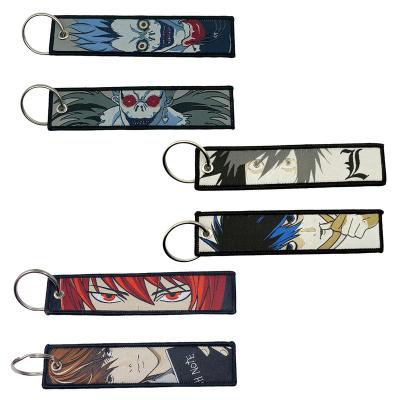 China Daily Life Best Selling Custom Popular Hunter Anime Double Side Fabric Embroidery Keychain for sale