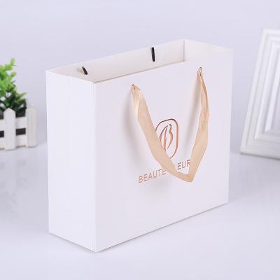 China Recyclable Luxury Retail Shopping Gift Boutique Packaging Custom Printed Small White Paper Bag With Your Own Logo for sale