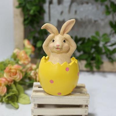 China Europe European Country Style Resin Colored Easter Bunny Sitting on Eggshell Don't Listen, Read, Tell Table Ornaments for sale