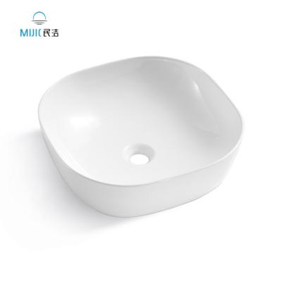 China Modern Luxury Bathroom Sanitary Ware Handmade Hotel Bathroom Sinks Ceramic Lavatory Glossy White Sink Countertop Wash Basin for sale