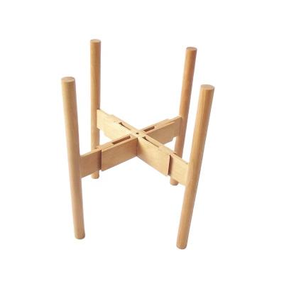 China Simple Modern Europe Flower Pot Wood Frame Flower Stand Living Room Japanese Beech Log Flower Pot Bottom Nordic Solid Wood Cross Bracket for sale