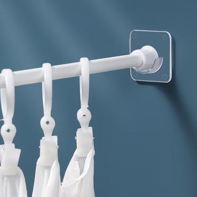 China Popular Self Adhesive Rod Holders Hooks Kitchen Bathroom Storage Accessories Strong Rod Holder Clothes Rail Curtain Bracket for sale