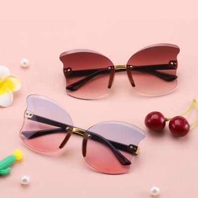 China 15 Years Experience DOISYER 2021 Kids Sunglasses Party Fashion Lenses Rimless Balanced Irregular Sunglasses Wholesale Kids for sale