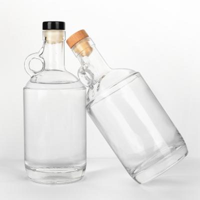 China Luxury 750ml Illegal Liquor 750ml Clear Jug Glass Spirit Liquor Bottle With Bar Top Cork And Handle for sale