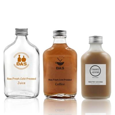 China Beverage 50ml 100ml 200ml Clear Wine Liquor Juice Beverage Flat Flask Cold Vodka Brew Coffee Glass Bottle For Kombucha Milk With Lid for sale