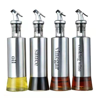 China Stainless Steel Spill Spout Kitchen 200ml 300ml 500ml Dorica Glass Sacue Cooking Olive Oil Glass Bottle With Pourer Spouts Stainless Steel Cover for sale