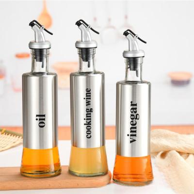 China Stainless Steel Spill Spout Wholesale 200ml 500ml Dorica Vinegar Sauce Cooking Olive Oil Glass Bottle With Pourer Spouts for sale