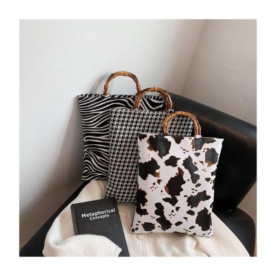 China Fashion high quality leather women shoulder bags zebra pattern fashion bamboo handle cow and bucket small bags houndstooth handbags for sale