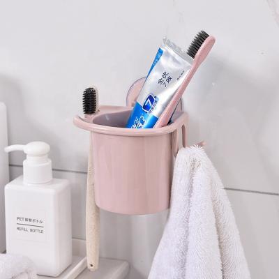 China Wall Mounted Organizer Sustainable Plastic Bathroom Accessories Toothbrush Toothpaste Holder Kitchen Bathroom for sale