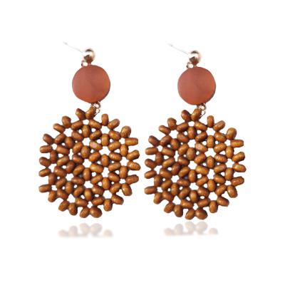 China Vintage Round Shape Handmade Wooden Beads Woman Earrings Vintage Hollow Out National Style Fashion Exaggerated Geometry Jewelry for sale