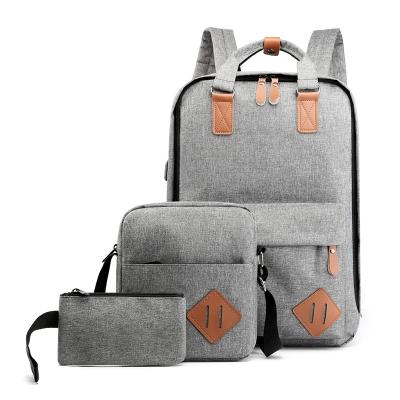 China Waterproof wholesale three-piece laptop backpack custom logo college school student bagpack with USB charging port for sale