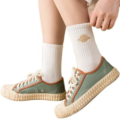 China Cartoon Embroidery Cotton Student Socks Manufacturer Cute Pattern Fashion Embroidery Planet Antibacterial Wholesale Women Socks for sale