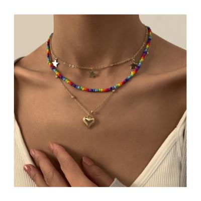 China Retro Style Cost Effective Bohemian Metal Lady Beaded Necklace With Heart Pendant for sale