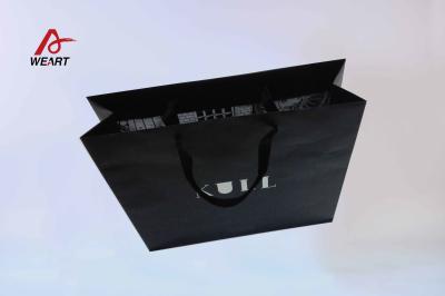 China Debossed Finishing Art Paper Bags / Black Custom Retail Shopping Bags for sale