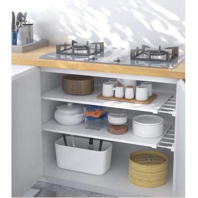 China Adjustable Length 61-102cm Kitchen Shelving Rack Shelf Storage Organizer Cupboard Racks and Holders Hot Selling Viable Te koop